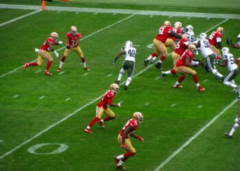 Who was the Boston College quarterback famous for the game-winning touchdown pass he threw against the Miami Hurricanes in 1984?